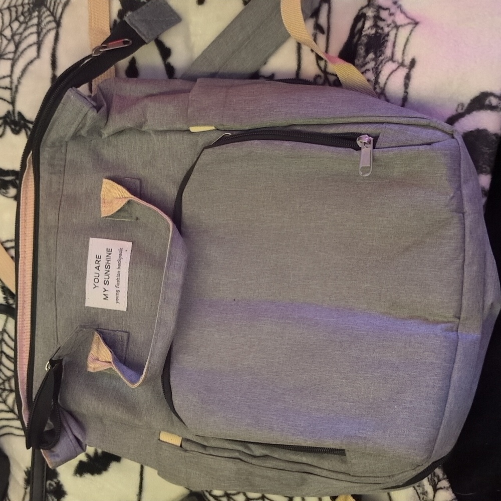 Baby diaper bag w/ playpen in it , bottles